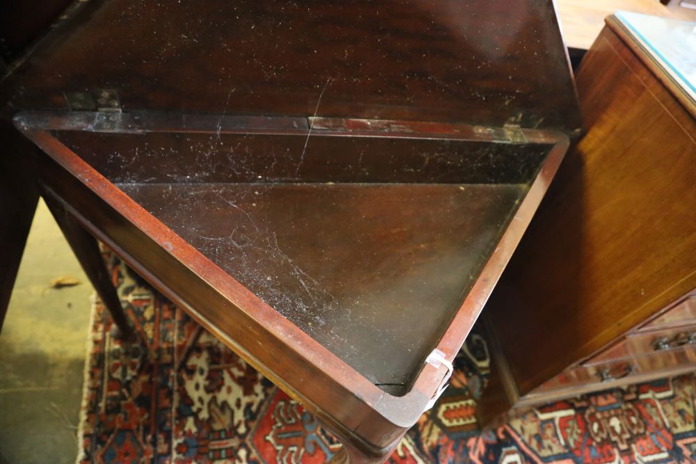 A George III triangular mahogany pad foot drop leaf table, width 90cm, depth 46cm, height 70cm